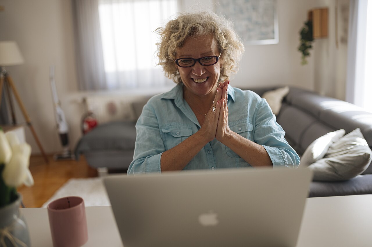 Smiling woman on a video call at home